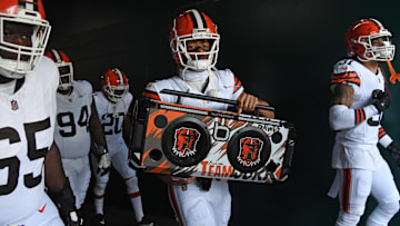 Oct 13, 2024; Philadelphia, Pennsylvania, USA; Cleveland Browns cornerback Greg Newsome II (0) carries a boom box onto the field against the Philadelphia Eagles at Lincoln Financial Field. Mandatory Credit: Eric Hartline-Imagn Images