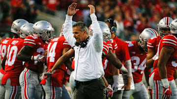 Ohio State Buckeyes head coach Urban Meyer pumps his arms as the Buckeyes take the field before a NCAA college football game between the Ohio State Buckeyes and the Oklahoma Sooners on Saturday, September 9, 2017 at Ohio Stadium in Columbus, Ohio. [Joshua A. Bickel/Dispatch]