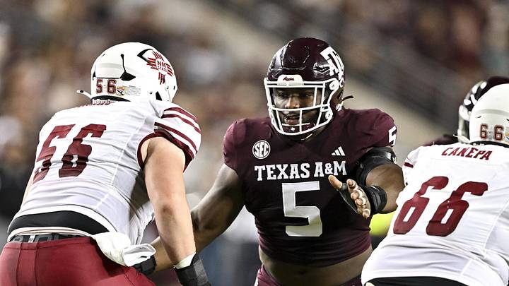 Nov 16, 2024; College Station, Texas, USA; Texas A&M Aggies defensive lineman Shemar Turner (5) defends in coverage against the New Mexico State Aggies during the first half at Kyle Field. Mandatory Credit: Maria Lysaker-Imagn Images 