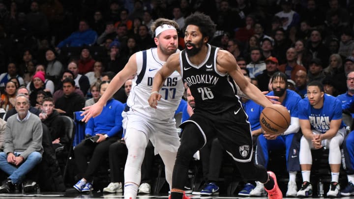 Feb 6, 2024; Brooklyn, New York, USA; Brooklyn Nets guard Spencer Dinwiddie (26) dribbles while being defended by Dallas Mavericks guard Luka Doncic (77) during the fourth quarter at Barclays Center. Mandatory Credit: John Jones-USA TODAY Sports