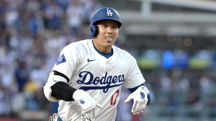 Aug 28, 2024; Los Angeles, California, USA;  Los Angeles Dodgers designated hitter Shohei Ohtani (17) gestures to the dugout as he rounds the bases after hitting a solo home run in the first inning against the Baltimore Orioles at Dodger Stadium. Mandatory Credit: Jayne Kamin-Oncea-USA TODAY Sports