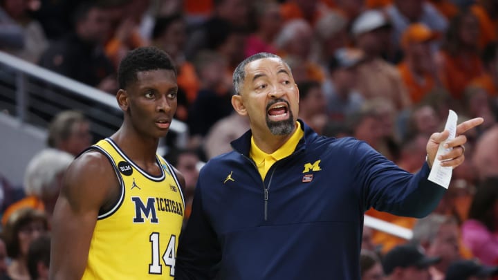 Mar 19, 2022; Indianapolis, IN, USA; Michigan Wolverines head coach Juwan Howard speaks with Michigan Wolverines forward Moussa Diabate (14) in the second half against the Tennessee Volunteers during the second round of the 2022 NCAA Tournament at Gainbridge Fieldhouse. Mandatory Credit: Trevor Ruszkowski-USA TODAY Sports