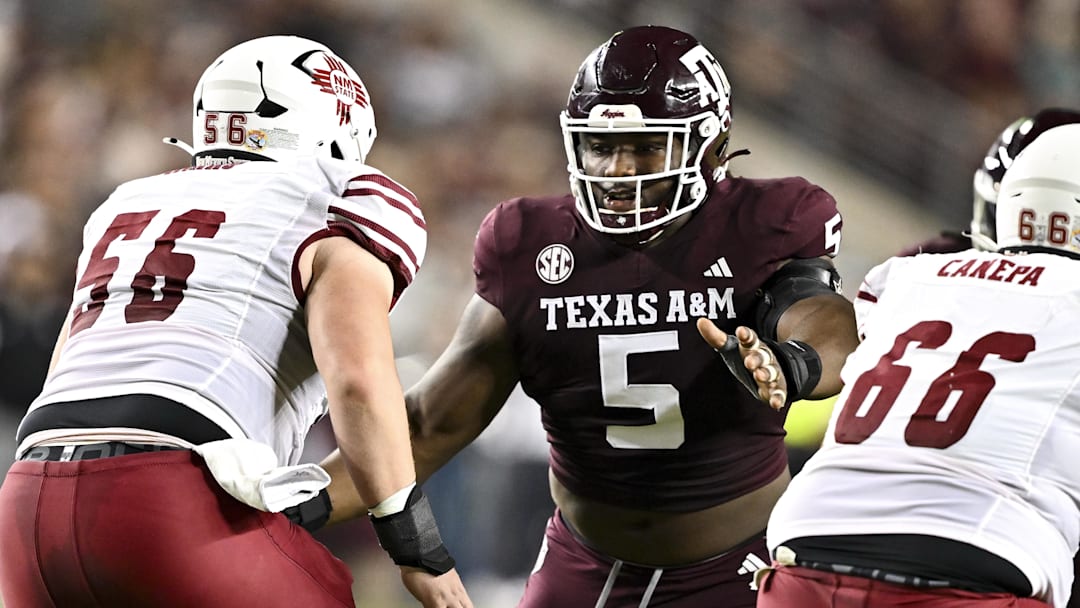 Nov 16, 2024; College Station, Texas, USA; Texas A&M Aggies defensive lineman Shemar Turner (5) defends in coverage against the New Mexico State Aggies during the first half at Kyle Field.