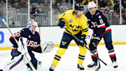 Feb 17, 2025; Boston, MA, USA; [Imagn Images direct customers only]  Team Sweden forward Adrian Kempe (10) and Team USA defenseman Zach Werenski (8) battle for position in front of goalie Jake Ottinger (30) during the second period in a 4 Nations Face-Off ice hockey game at TD Garden. Mandatory Credit: Bob DeChiara-Imagn Images
