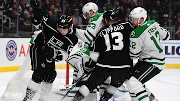 Jan 8, 2020; Los Angeles, California, USA; Los Angeles Kings right wing Dustin Brown (23) and left wing Kyle Clifford (13) battle for the puck with Dallas Stars defenseman Esa Lindell (23) and center Radek Faksa (12)   in the second period at Staples Center. Mandatory Credit: Kirby Lee-Imagn Images