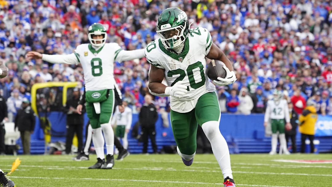 Dec 29, 2024; Orchard Park, New York, USA; New York Jets running back Breece Hall (20) runs with the ball against the Buffalo Bills during the first half at Highmark Stadium. Mandatory Credit: Gregory Fisher-Imagn Images