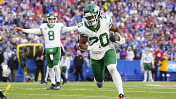 Dec 29, 2024; Orchard Park, New York, USA; New York Jets running back Breece Hall (20) runs with the ball against the Buffalo Bills during the first half at Highmark Stadium. Mandatory Credit: Gregory Fisher-Imagn Images