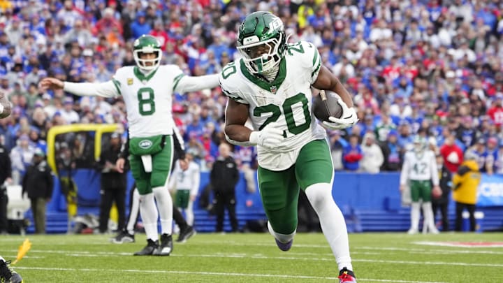 Dec 29, 2024; Orchard Park, New York, USA; New York Jets running back Breece Hall (20) runs with the ball against the Buffalo Bills during the first half at Highmark Stadium. Mandatory Credit: Gregory Fisher-Imagn Images