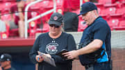 May 11, 2023; Fayetteville, AK, USA;  South Carolina Gamecocks head coach Beverly Smith goes over the lineup with the umpire during a quarterfinal game against the Georgia Bulldogs in the SEC Softball Tournament. Mandatory Credit: Brett Rojo-USA TODAY Sports