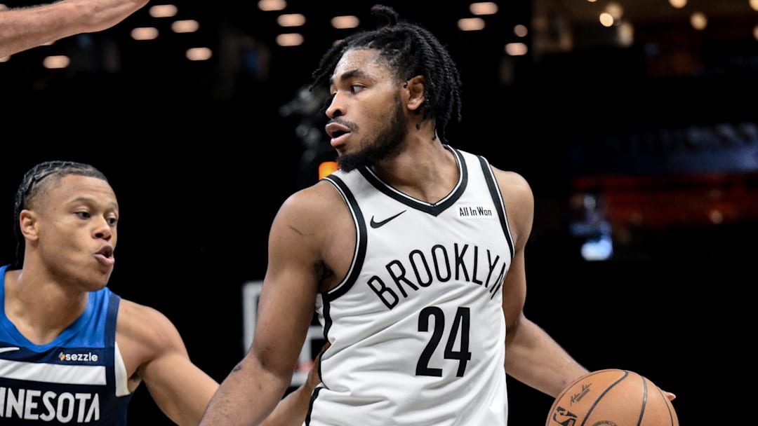 Nov 3, 2025; Brooklyn, New York, USA; Brooklyn Nets guard Cam Thomas (24) tries to drive past Minnesota Timberwolves center Rudy Gobert (27) and guard Jaylen Clark (22) during the second half at Barclays Center. Mandatory Credit: John Jones-Imagn Images
