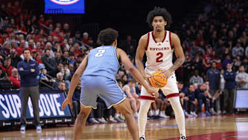 Rutgers Scarlet Knights guard Dylan Harper (2) looks to pass during the second half as Columbia Lions guard Kenny Noland (2) defends at Jersey Mike's Arena.