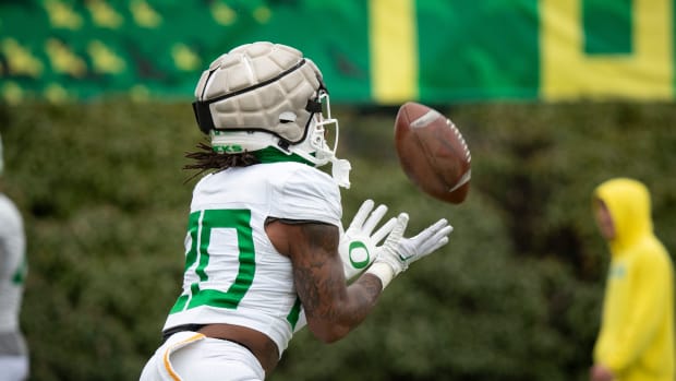 Oregon running back Jordan James catches a kick return during practice with the Oregon Ducks 