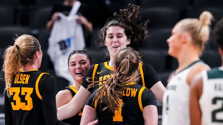 The Iowa Hawkeyes celebrate Iowa Hawkeyes center Ava Heiden (5) on Thursday, March 6, 2025, in a round two game at the 2025 TIAA Big Ten Women's Basketball Tournament between the Iowa Hawkeyes and the Michigan State Spartans at Gainbridge Fieldhouse in Indianapolis.