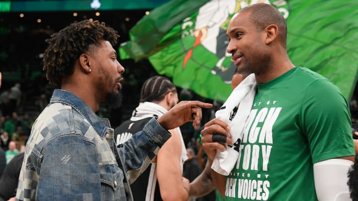  Boston Celtics center Al Horford (42) (r) speaks to Memphis Grizzlies guard Marcus Smart (36) (l) after a game at TD Garden. 