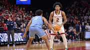 Dec 30, 2024; Piscataway, New Jersey, USA; Rutgers Scarlet Knights guard Dylan Harper (2) looks to pass during the second half as Columbia Lions guard Kenny Noland (2) defends at Jersey Mike's Arena. Mandatory Credit: Vincent Carchietta-Imagn Images