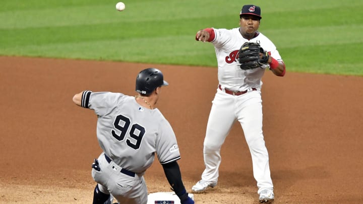 Oct 5, 2017; Cleveland, OH, USA; Cleveland Indians third baseman Jose Ramirez (11) turns a double play over New York Yankees right fielder Aaron Judge (99) during the fourth inning in game one of the 2017 ALDS at Progressive Field. Mandatory Credit: David Richard-USA TODAY Sports