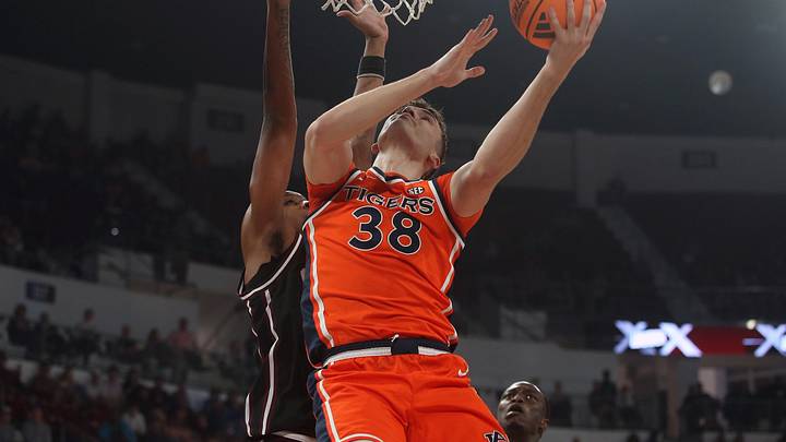 Feb 18, 2026; Starkville, Mississippi, USA; Auburn Tigers forward Filip Jovic (38) shoots as Mississippi State Bulldogs forward Jamarion Davis-Fleming (0) defends during the first half at Humphrey Coliseum. Mandatory Credit: Petre Thomas-Imagn Images