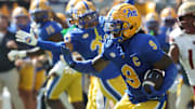Oct 4, 2025; Pittsburgh, Pennsylvania, USA;  Pittsburgh Panthers linebacker Kyle Louis (9) runs after fumble recovery against the Boston College Eagles during the second quarter at Acrisure Stadium. Mandatory Credit: Charles LeClaire-Imagn Images