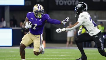 Aug 31, 2024; Seattle, Washington, USA; Washington Huskies running back Jonah Coleman (1) rushes against the Weber State Wildcats during the first quarter at Alaska Airlines Field at Husky Stadium. Mandatory Credit: Joe Nicholson-USA TODAY Sports