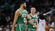 Boston Celtics forward Jayson Tatum talks with Celtics guard Payton Pritchard in a timeout against the Washington Wizards.