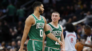  Boston Celtics forward Jayson Tatum talks with Celtics guard Payton Pritchard in a timeout against the Washington Wizards.