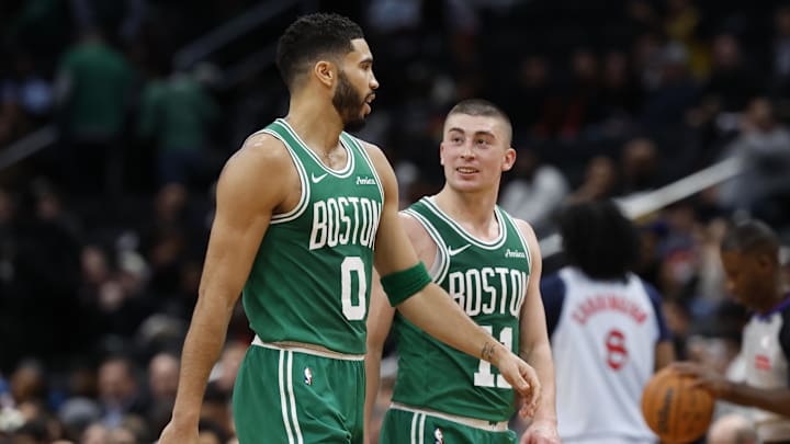 Boston Celtics forward Jayson Tatum talks with Celtics guard Payton Pritchard in a timeout against the Washington Wizards. Boston Celtics forward Jayson Tatum talks with Celtics guard Payton Pritchard in a timeout against the Washington Wizards.