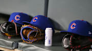 Apr 3, 2019; Atlanta, GA, USA; Detailed view of Chicago Cubs hats and gloves in the dugout against the Atlanta Braves in the fifth inning at SunTrust Park. Mandatory Credit: Brett Davis-Imagn Images
