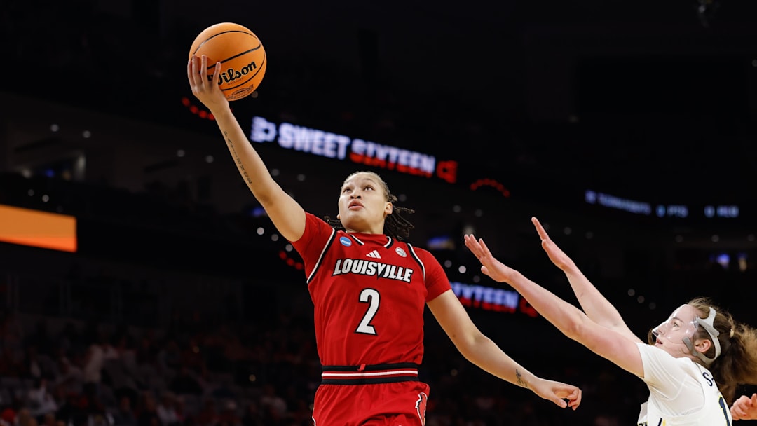 Mar 28, 2026; Fort Worth, TX, USA;  Louisville Cardinals guard Imari Berry (2) scores a layup ahead of Michigan Wolverines guard Syla Swords (12) during the first half at Dickies Arena. Mandatory Credit: Chris Jones-Imagn Images