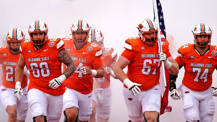 Oklahoma State runs on to the field before the college football game between the Oklahoma State Cowboys and South Dakota State Jackrabbits at Boone Pickens Stadium in Stillwater, Okla., Saturday, Aug., 31, 2024.