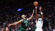 Mar 1, 2024; Boston, Massachusetts, USA; Dallas Mavericks guard Kyrie Irving (11) shoots against Boston Celtics guard Derrick White (9) in the second quarter at TD Garden. Mandatory Credit: David Butler II-USA TODAY Sports