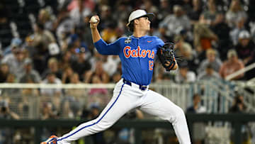 Jun 15, 2024; Omaha, NE, USA;  Florida Gators starting pitcher Liam Peterson (12) throws against the Texas A&M Aggies during the first inning at Charles Schwab Field Omaha. Mandatory Credit: Steven Branscombe-Imagn Images