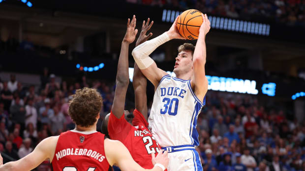 Mar 31, 2024; Dallas, TX, USA; Duke Blue Devils center Kyle Filipowski (30) shoots against North Carolina State Wolfpack forw