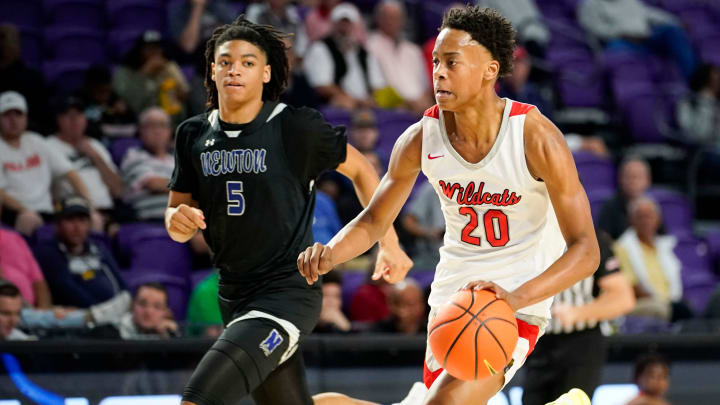 Lake Highlands Wildcats guard Tre Johnson (20) handles the ball during the first quarter of a game against the Newton Rams during the 49th annual City of Palms Classic at Suncoast Arena in Ft. Myers on Friday, Dec. 16, 2022.

Lakehighland V Newton Cop 0002