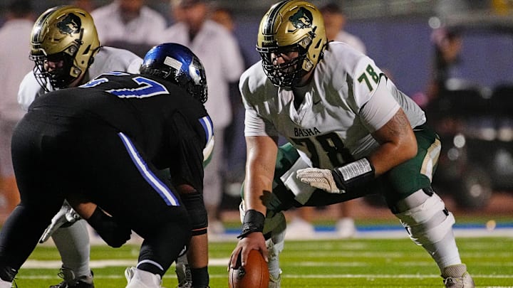 Basha guard Sam Garcia (78) takes snaps as a center after an injury during a game at Chandler High School on Oct. 25, 2024, in Chandler. Basha guard Sam Garcia (78) takes snaps as a center after an injury during a game at Chandler High School on Oct. 25, 2024, in Chandler.