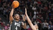 March 9, 2025; Las Vegas, NV, USA; Washington State Cougars forward LeJuan Watts (4) shoots the basketball against San Francisco Dons forward Junjie Wang (35) during the first half in the quarterfinal of the West Coast Conference tournament at Orleans Arena.
