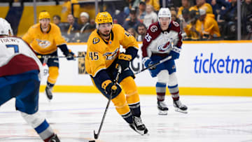 Nov 2, 2024; Nashville, Tennessee, USA;  Nashville Predators defenseman Alexandre Carrier (45) skates with the puck against the Colorado Avalanche during the third period at Bridgestone Arena. Mandatory Credit: Steve Roberts-Imagn Images