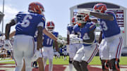 Florida Gators running back Ja'Kobi Jackson (24) celebrates with teammates after a touchdown against the Mississippi State Bulldogs during the second quarter at Davis Wade Stadium at Scott Field.