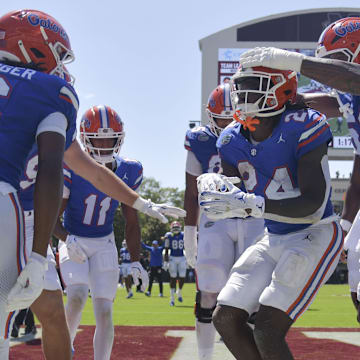 Florida Gators running back Ja'Kobi Jackson (24) celebrates with teammates after a touchdown against the Mississippi State Bulldogs during the second quarter at Davis Wade Stadium at Scott Field.
