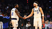 Dec 27, 2024; Phoenix, Arizona, USA; Dallas Mavericks guard Kyrie Irving (11) and Klay Thompson (31) against the Phoenix Suns at Footprint Center. Mandatory Credit: Mark J. Rebilas-Imagn Images