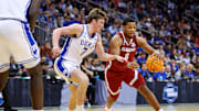 Mar 29, 2025; Newark, NJ, USA; Alabama Crimson Tide guard Chris Youngblood (8) drives to the basket against Duke Blue Devils guard Kon Knueppel (7) during the second half in the East Regional final of the 2025 NCAA tournament at Prudential Center. Mandatory Credit: Vincent Carchietta-Imagn Images