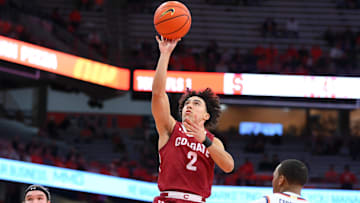 Nov 14, 2023; Syracuse, New York, USA; Colgate Raiders guard Braeden Smith (2) shoots the ball over Syracuse Orange guard Quadir Copeland (24) during the first half at the JMA Wireless Dome. Mandatory Credit: Rich Barnes-USA TODAY Sports