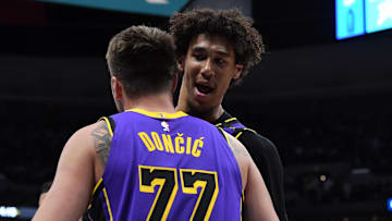 Feb 22, 2025; Denver, Colorado, USA; Los Angeles Lakers guard Luka Doncic (77) is congratulated by center Jaxson Hayes (11) after making a basket during the second half against the Denver Nuggets at Ball Arena. Mandatory Credit: Christopher Hanewinckel-Imagn Images