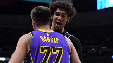 Feb 22, 2025; Denver, Colorado, USA; Los Angeles Lakers guard Luka Doncic (77) is congratulated by center Jaxson Hayes (11) after making a basket during the second half against the Denver Nuggets at Ball Arena. Mandatory Credit: Christopher Hanewinckel-Imagn Images