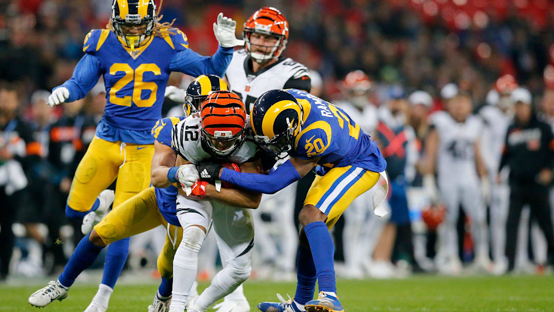 Cincinnati Bengals wide receiver Alex Erickson (12) is brought down by Los Angeles Rams cornerback Jalen Ramsey (20) after a deep pass in the fourth quarter of the NFL Week 8 game between the Los Angeles Rams and the Cincinnati Bengals at Wembley Stadium in Wembley, London, on Sunday, Oct. 27, 2019. The Bengals lost 24-10, advancing to 0-8 on the season.

Cincinnati Bengals At Los Angeles Rams International Series