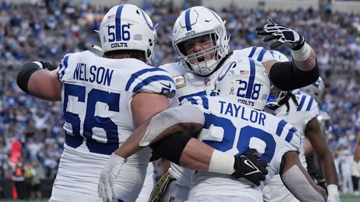 Nov 5, 2023; Charlotte, North Carolina, USA; Indianapolis Colts running back Jonathan Taylor (28) celebrates with guard Quenton Nelson (56) and center Ryan Kelly (78) after scoring a touchdown in the second quarter at Bank of America Stadium. Mandatory Credit: Bob Donnan-Imagn Images