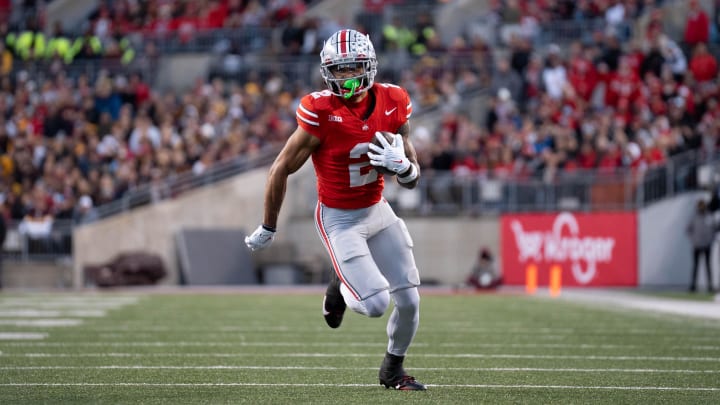 Nov 18, 2023; Columbus, Ohio, USA; 
Ohio State Buckeyes wide receiver Emeka Egbuka (2) runs down the field earning a first down against the Minnesota Golden Gophers during the first half of their game on Saturday, Nov. 18, 2023 at Ohio Stadium.