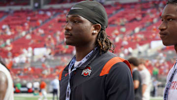 Sept. 21, 2024; Columbus, Ohio, USA; Glenville linebacker Cincere Johnson watches warm-ups before Ohio State's game against the Marshall University Thundering Herd at Ohio Stadium.