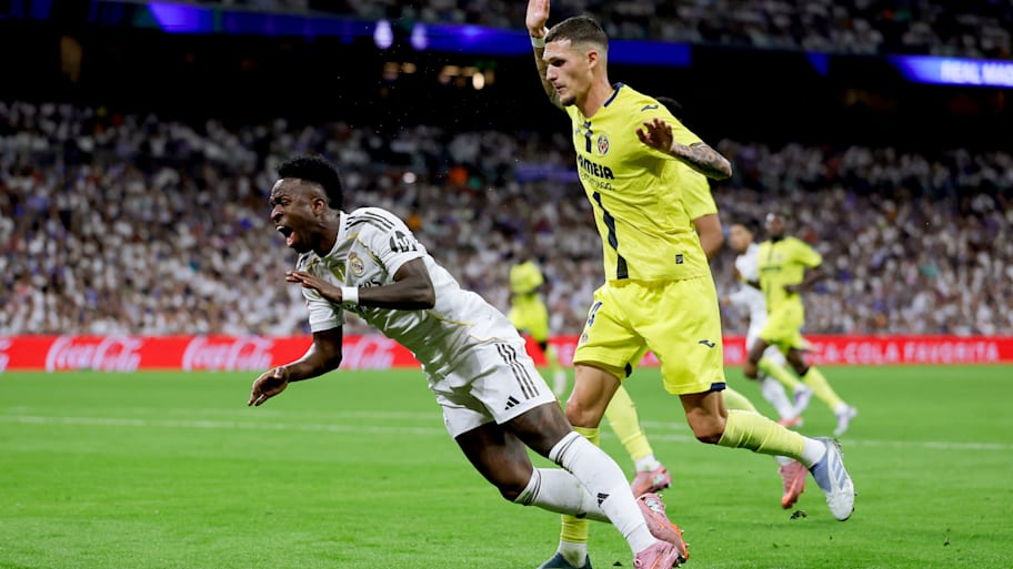 Vinícius Júnior (left) winning a penalty.