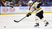 Apr 6, 2025; Buffalo, New York, USA;  Boston Bruins right wing David Pastrnak (88) takes a shot on goal during the third period against the Buffalo Sabres at KeyBank Center. Mandatory Credit: Timothy T. Ludwig-Imagn Images