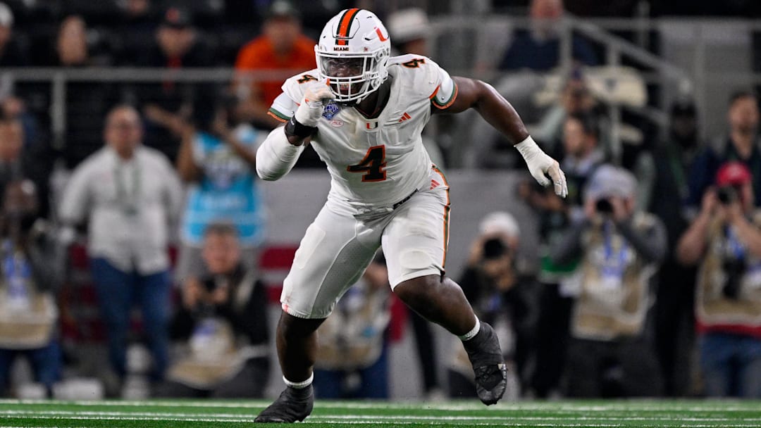 Dec 31, 2025; Arlington, TX, USA; Miami Hurricanes defensive lineman Rueben Bain Jr. (4) rushes the line during the 2025 Cotton Bowl and quarterfinal game of the College Football Playoff at AT&T Stadium. Mandatory Credit: Jerome Miron-Imagn Images